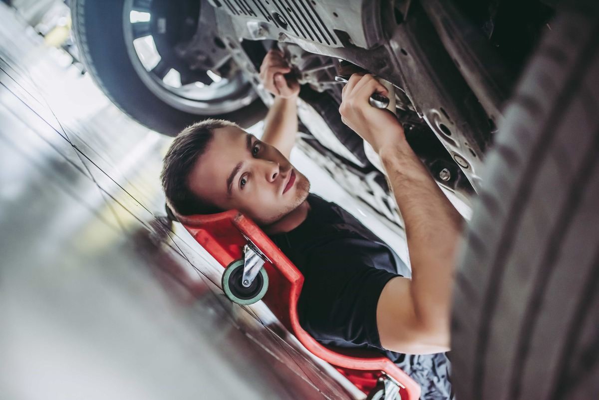 Mechanic checking car over.