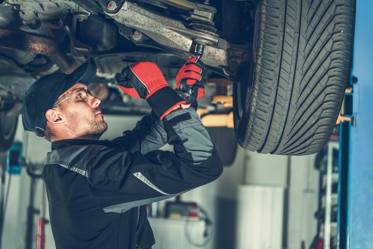 Mechanic repairing car.